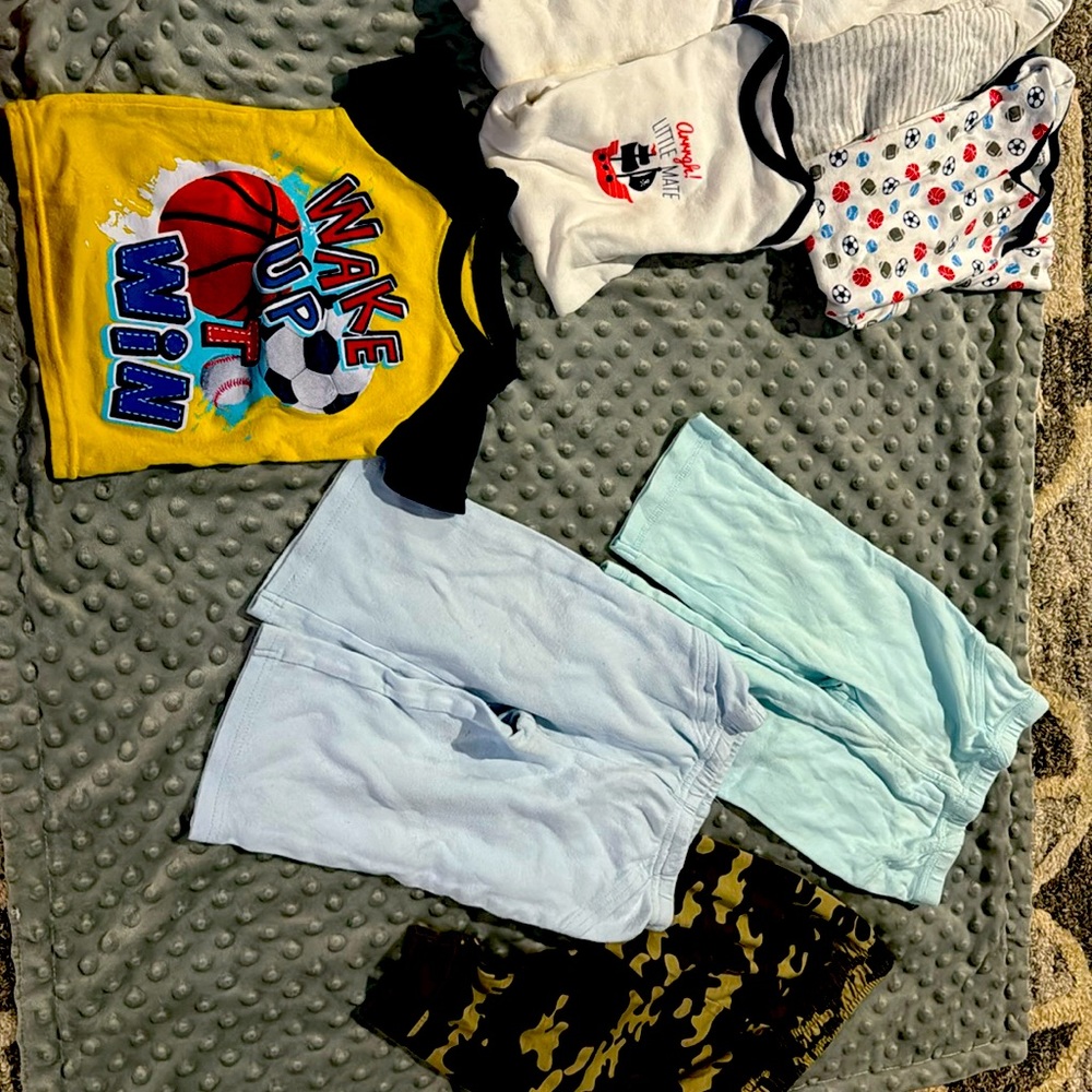 6 onsies, 3 pairs of pants and 1 short sleeved pajama shirt